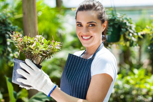 Gardener preparing for hedge trimming with tools